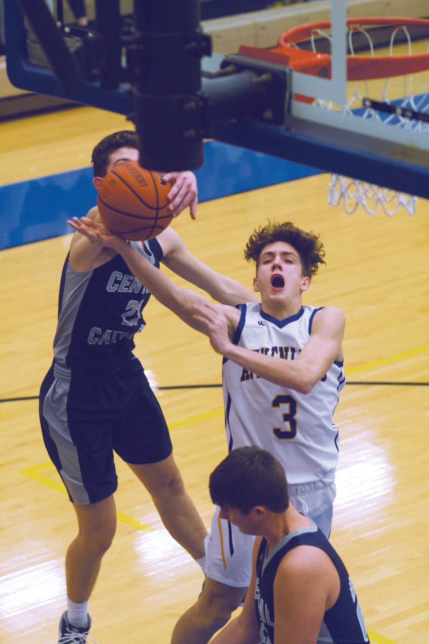 Ty Lynas gets a shot blocked from behind in Crawfordsville's 78-60 loss to Central Catholic on Tuesday.