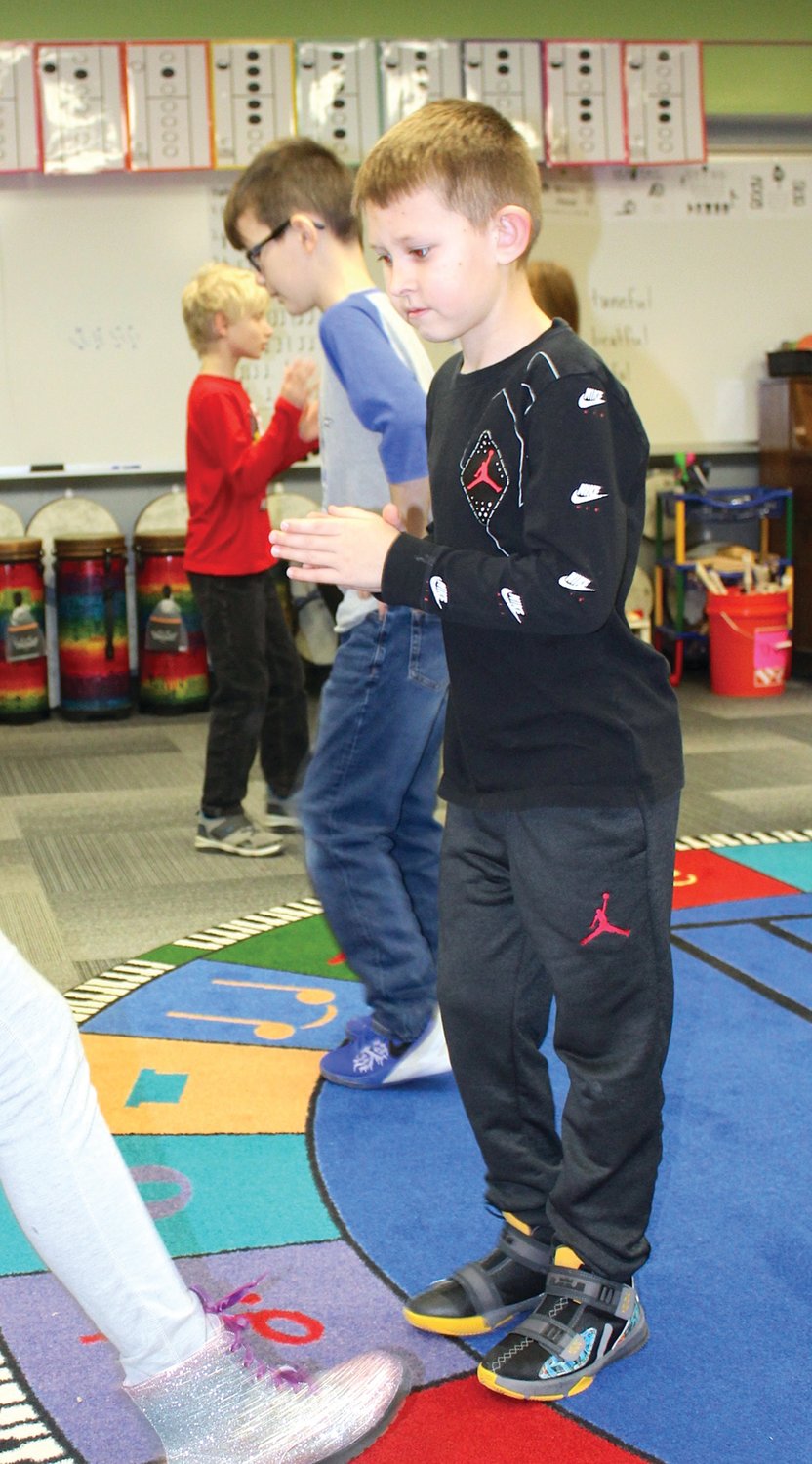 Cameran Holt practices his dance moves Thursday during music class at Ladoga Elementary.