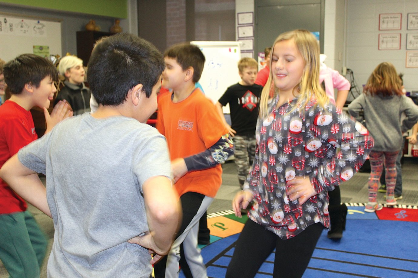 Ladoga Elementary music student Kaylee Wallace tries to mirror the moves of her dancing partner.