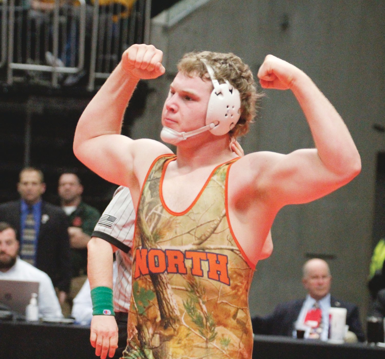 North Montgomery's Drew Webster flexes after winning his first round match at the state finals.