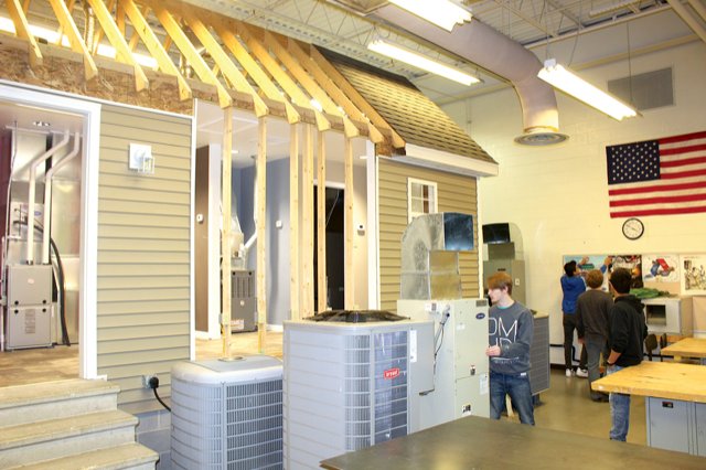 A model of a home filled with heating and air conditioning units sits inside the HVAC lab at Crawfordsville High School. Students from four school districts take advantage of the HVAC program each year.