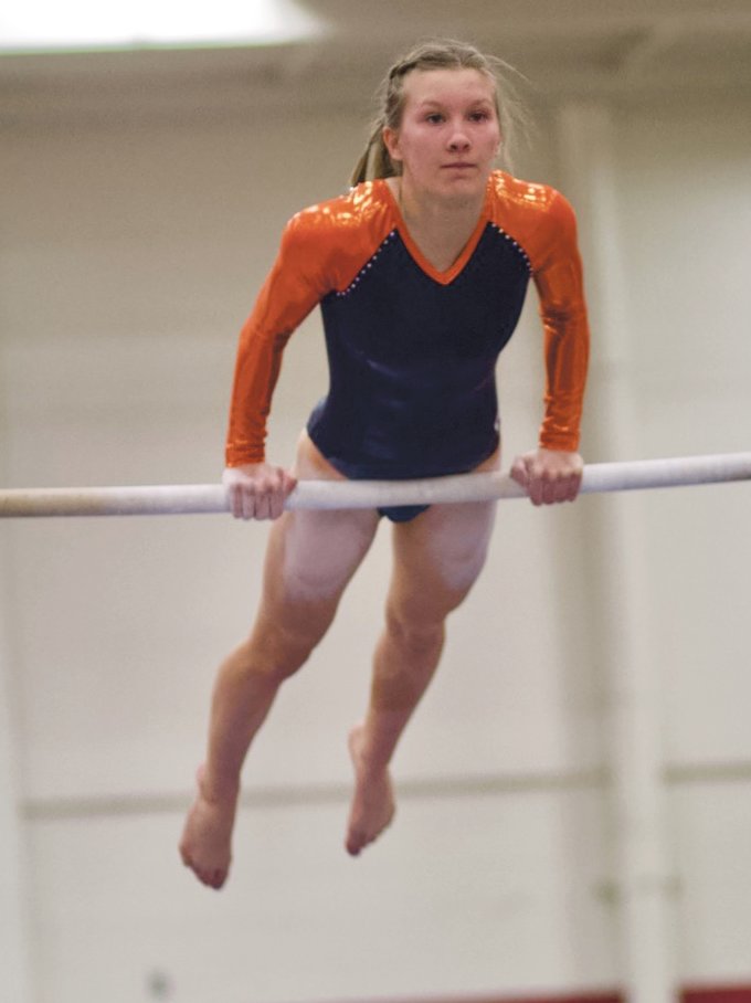 North Montgomery's caitlin Burns competes on the bars for the Chargers.