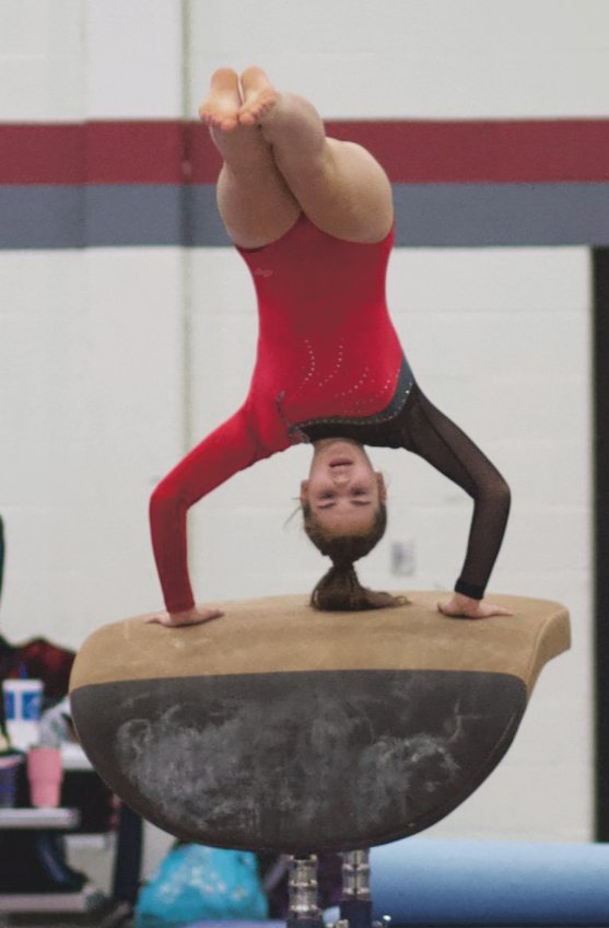 Southmont's Abigail Korhorn competes on the vault for the Mounties.
