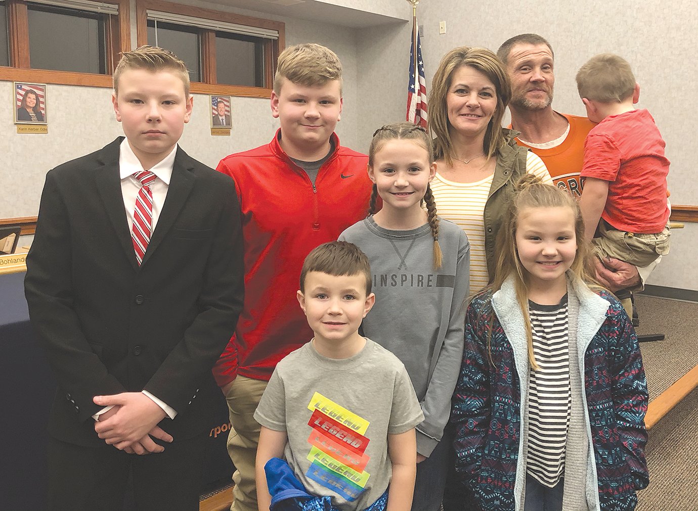 Honorary member of the North Montgomery school board of trustees Carson Grote, left, was flanked by his parents and siblings Monday during the district