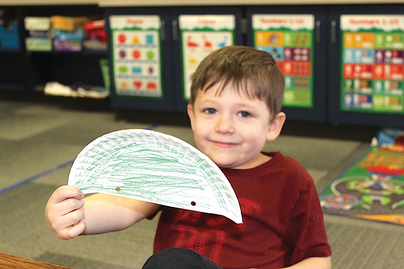 Asher Wallace, student at Little Mountie Preschool, shows off his coloring skills Thursday.