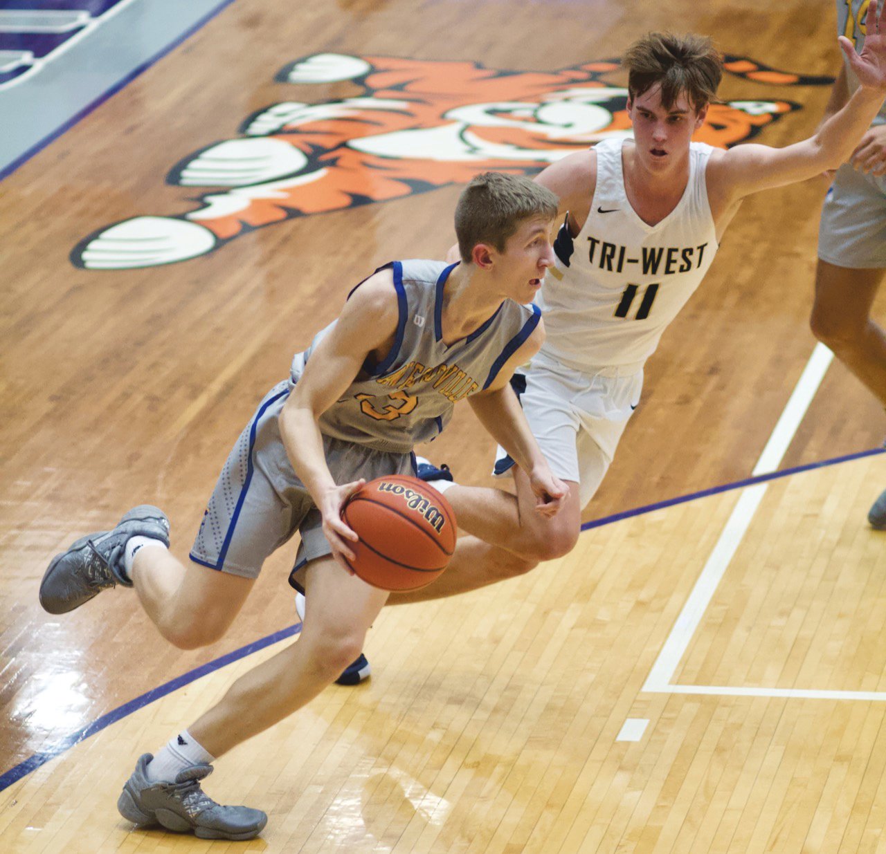 Ian Hensley drives baseline for the Athenians.