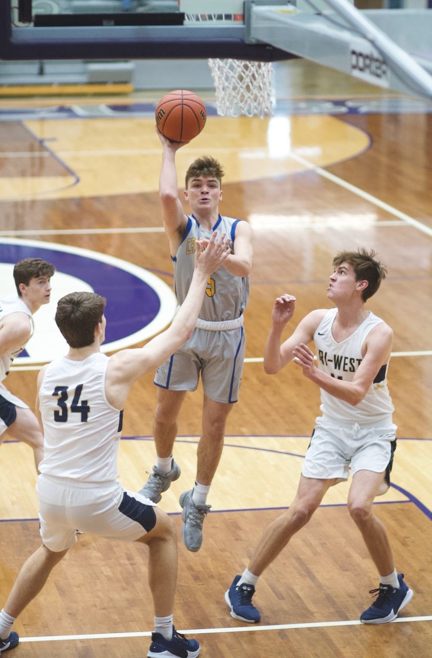 Crawfordsville senior Carson Scott takes a shot in the lane against Tri-West in the sectional at Greencastle.