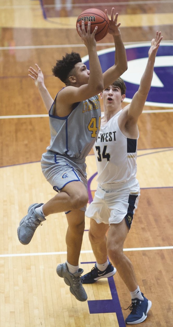 Crawfordsville's Mekhi Wallace drives in for a layup in the Athenians 81-80 sectional win over Tri-West on Wednesday.