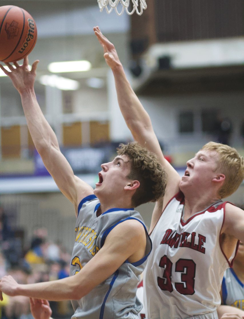 Crawfordsville junior Ty Lyans scoops in for a bucket against Danville last season. The senior led the Athenians with 23 points in a win over Heritage Christian on Tuesday.