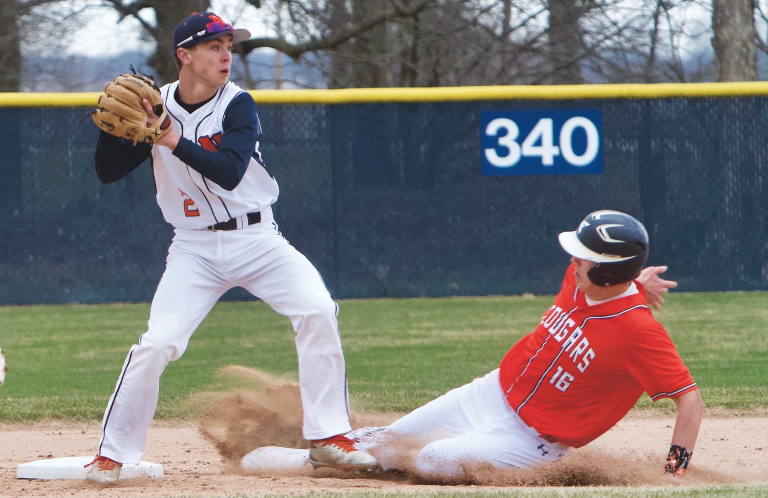 Kai Warren looks to turn a double-play for the Chargers in their 16-6 win over North Putnam last spring.