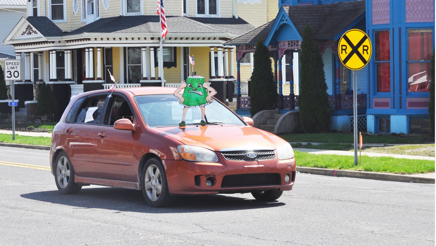 A Canner, the mascot of Ladoga Elementary School, is displayed on a vehicle in the Mountie March Thursday in downtown Ladoga.