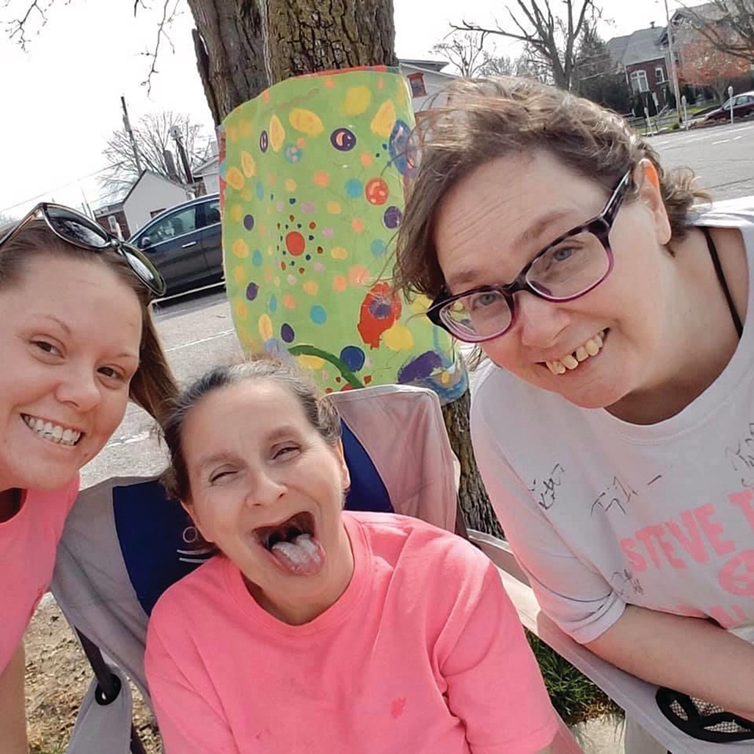 Emily, Tarah and Stephanie stand in front of a painting created by an Abilities Services Inc. consumer. The agency partnered with Crawfordsville Main Street and the city's Parks and Recreation Department for the project marking Disability Awareness Month in March..