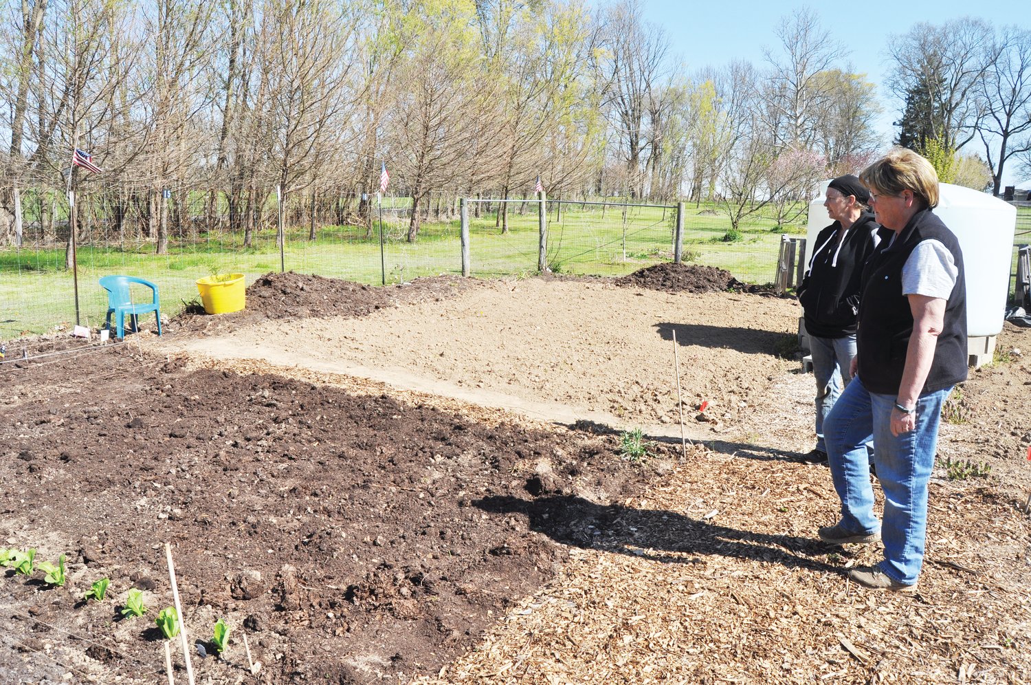 Sue Lucas, left, president of Sustainable Initiatives of Montgomery County, and Susan Smith, co-host of the Crawfordsville Community Garden, look at a freshly-planted plot.
