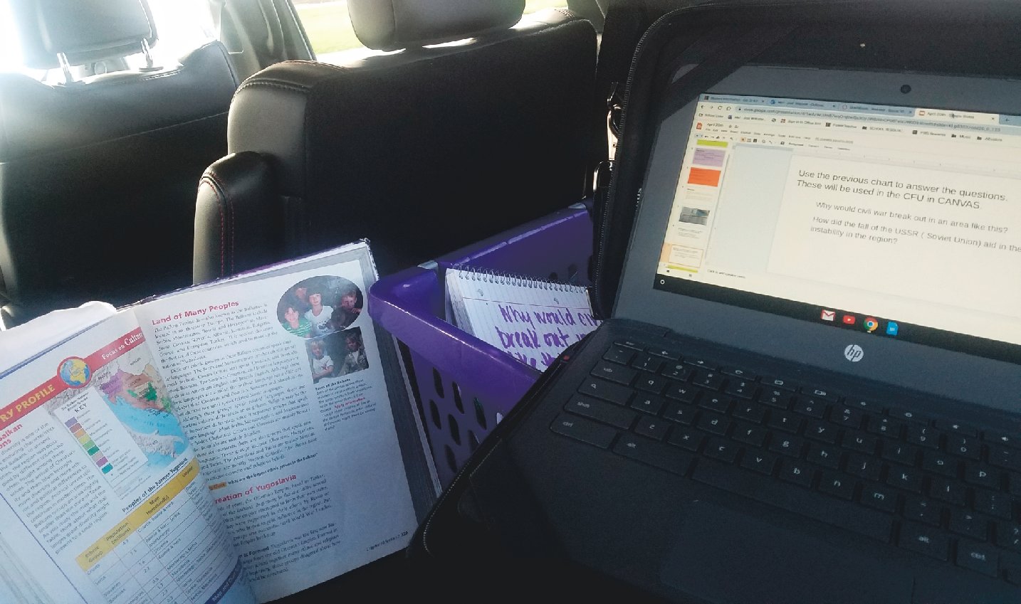 Northridge Middle School science teacher Jodi Webster sets up her virtual classroom in her car at North Montgomery High School for better internet access.
