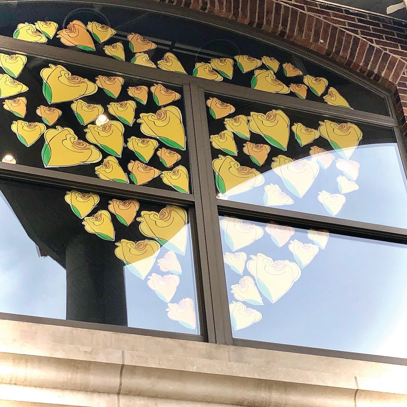 A show of support for local businesses is displayed in the second-floor window of the Fusion 54 building in downtown Crawfordsville.