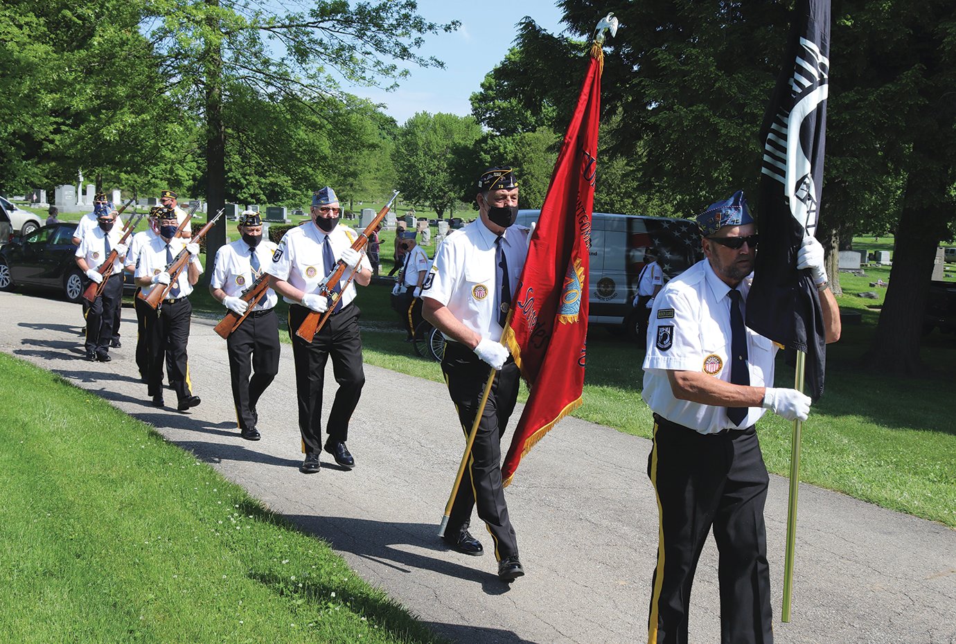 Military service members of Byron Cox American Legion Post #72 begin the Memorial Day Ceremony at Oak Hill Cemetery.