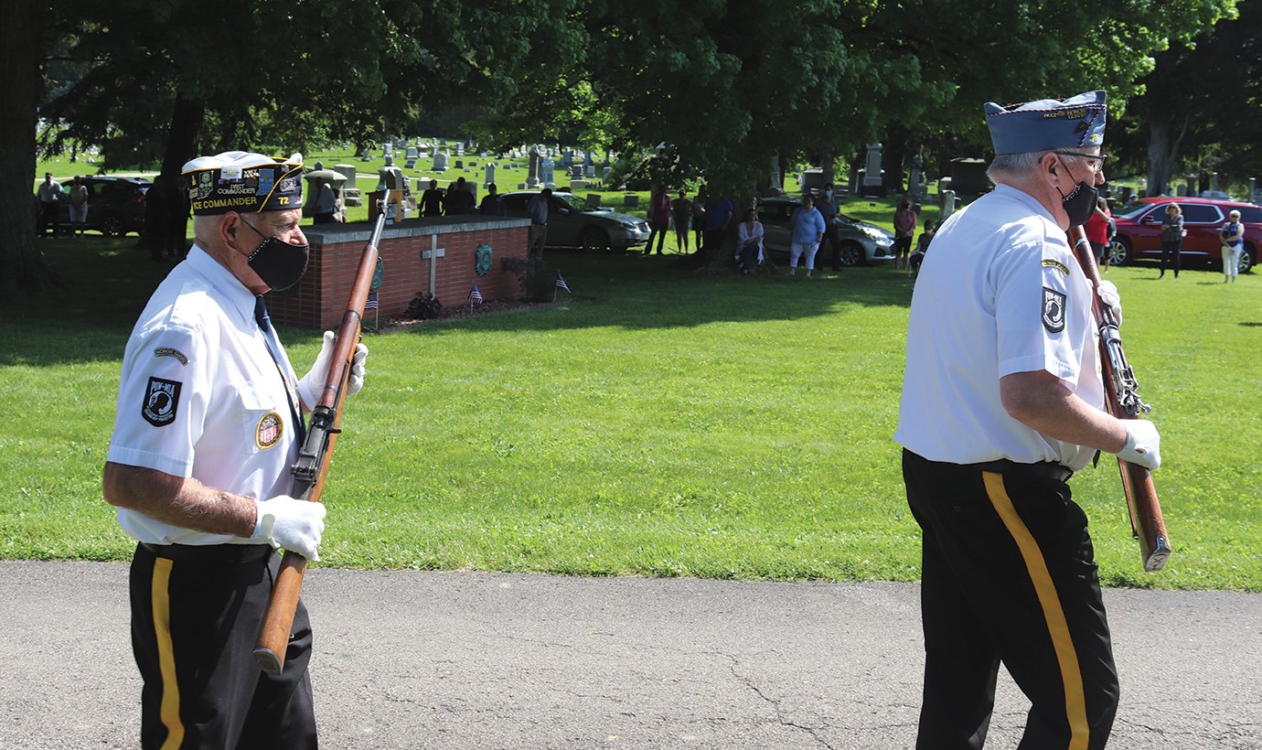 Memorial Day services at Oak Hill Cemetery during the ongoing coronavirus (COVID-19) pandemic saw dozens of dedicated citizens turn out Monday while veterans taking part in the service wear personal protection masks.