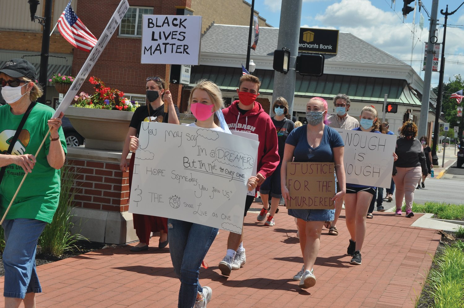 Marchers reach Pike Place during the March for Peace and Equality Saturday in downtown Crawfordsville. The event was organized by Humans United for Equality and Voices for Peace.