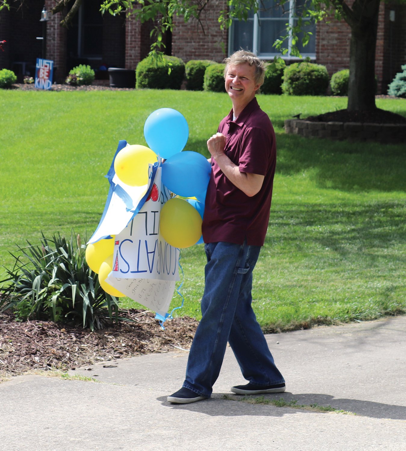 Crawfordsville Schools retiree Larry Hutchison is quickly overcome Wednesday with presents, baloons and feelings of gratitude during an impromptu parade in his honor.