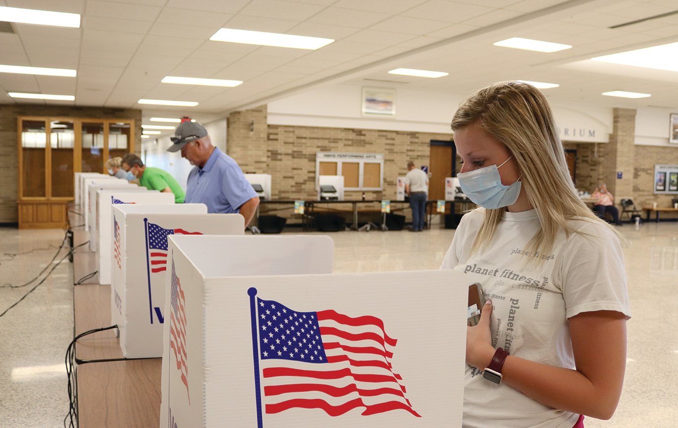 Jessika Voorhees, right, and Gary Winningham make their selections during Indiana's Primary Elections on Tuesday at North Montgomery High School.