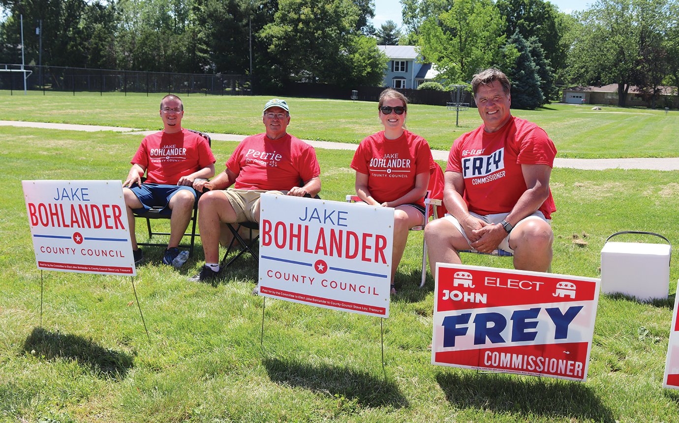 Jim Johnson, from left, Dale Petrie, Morgan Bohlander and Montgomery County commissioner candidate John Frey await voters Tuesday at Hoover Elementary.