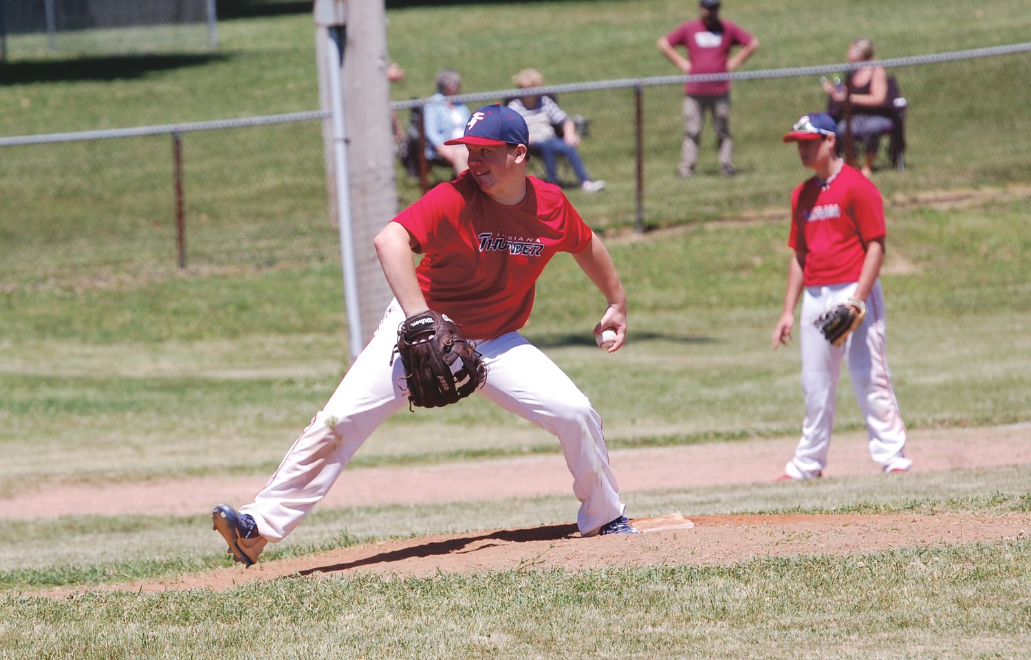 Ross Dyson fires a pitch home Sunday afternoon as the Indiana Thunder 14U team took on Harrison.