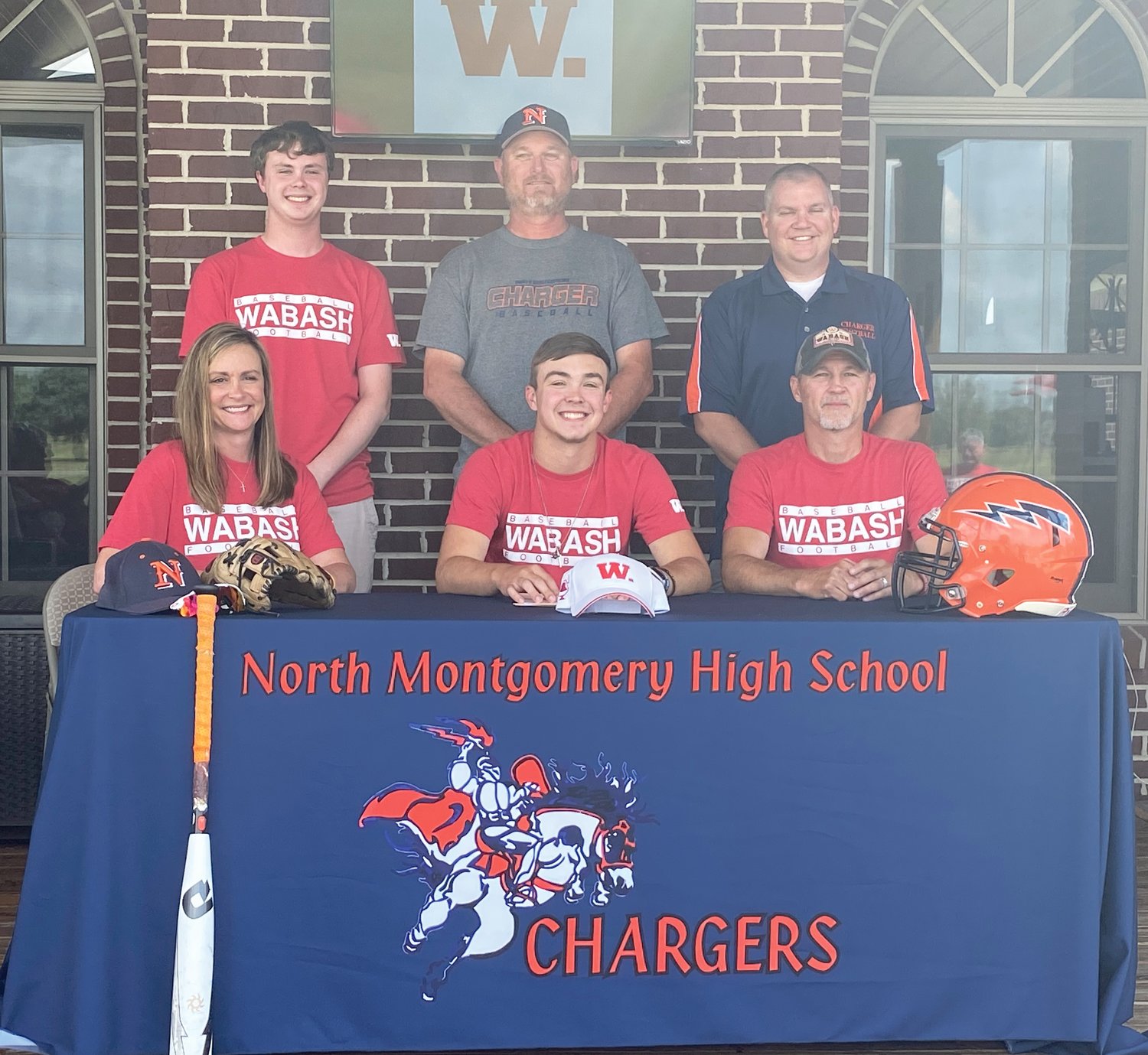 North Montgomery's Kai Warren will continue his baseball and football careers at Wabash College. PICTURED ABOVE: Warren is joined by his parents, Mike and Kim Warren and brother Kaleb, along with North Montgomery athletic director Matt Merica and football coach Josh Thompson.