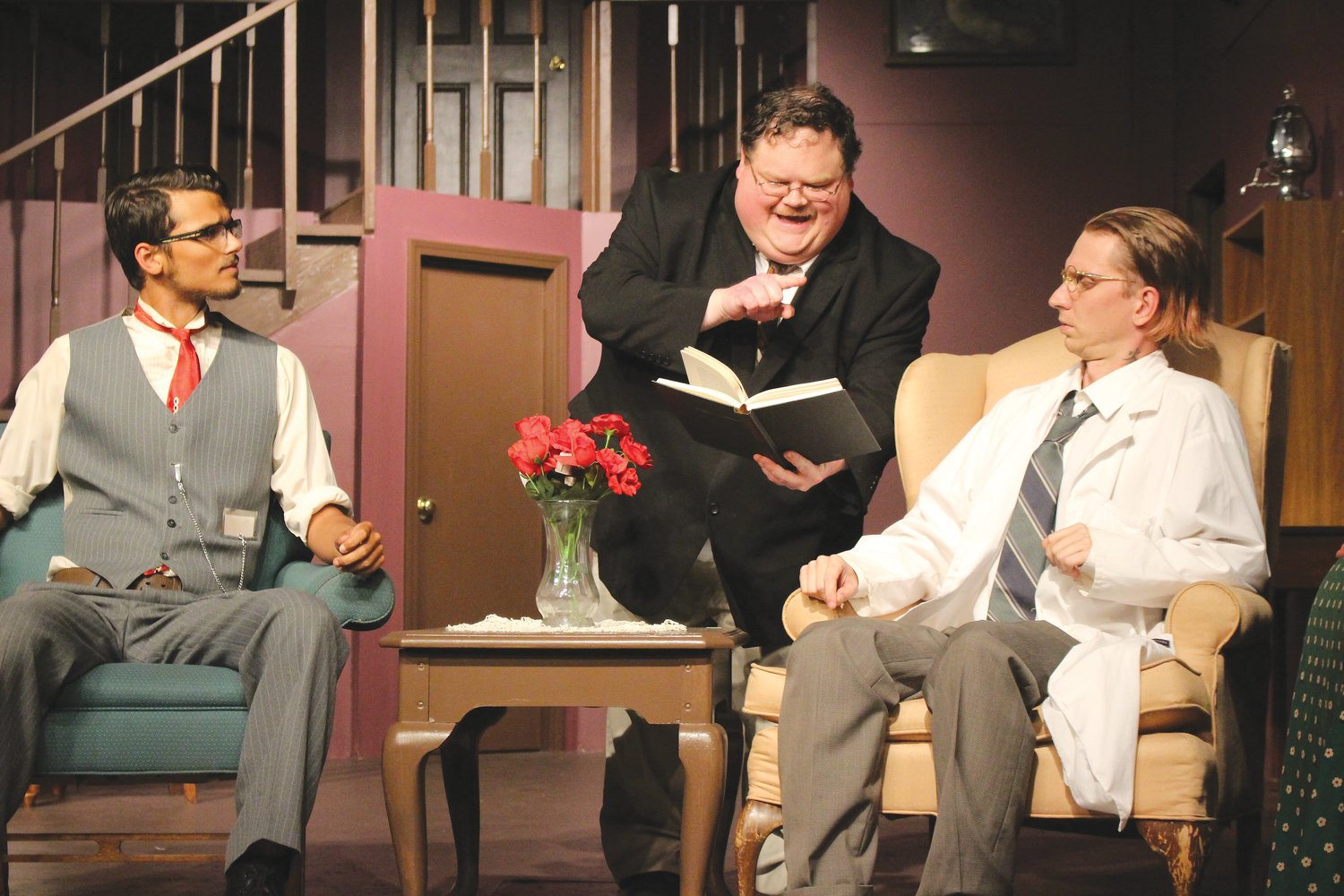 From left, Isaac Bacon (Jonathan Brewster), Dan Martin (Teddy Brewster) and Alan Hobson 
(Dr. Einstein) perform a scene from Arsenic and Old Lace, the Vanity Theater’s latest production.