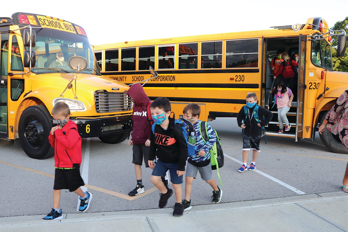 New Market Elementary students, anxious to begin their first day of school Thursday, head toward the entrance from buses that were visibly half full to promote social distancing during the ongoing coronavirus (COVID-19) pandemic.
