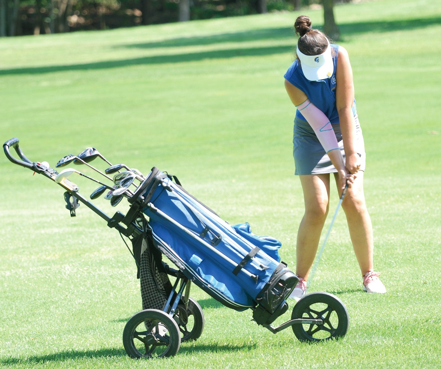 Crawfordsville's Bailey Mittal chips an approach show to the green at the Crawfordsville Country Club on Saturday afternoon. The senior led the Athenians with a personal best score of 89.