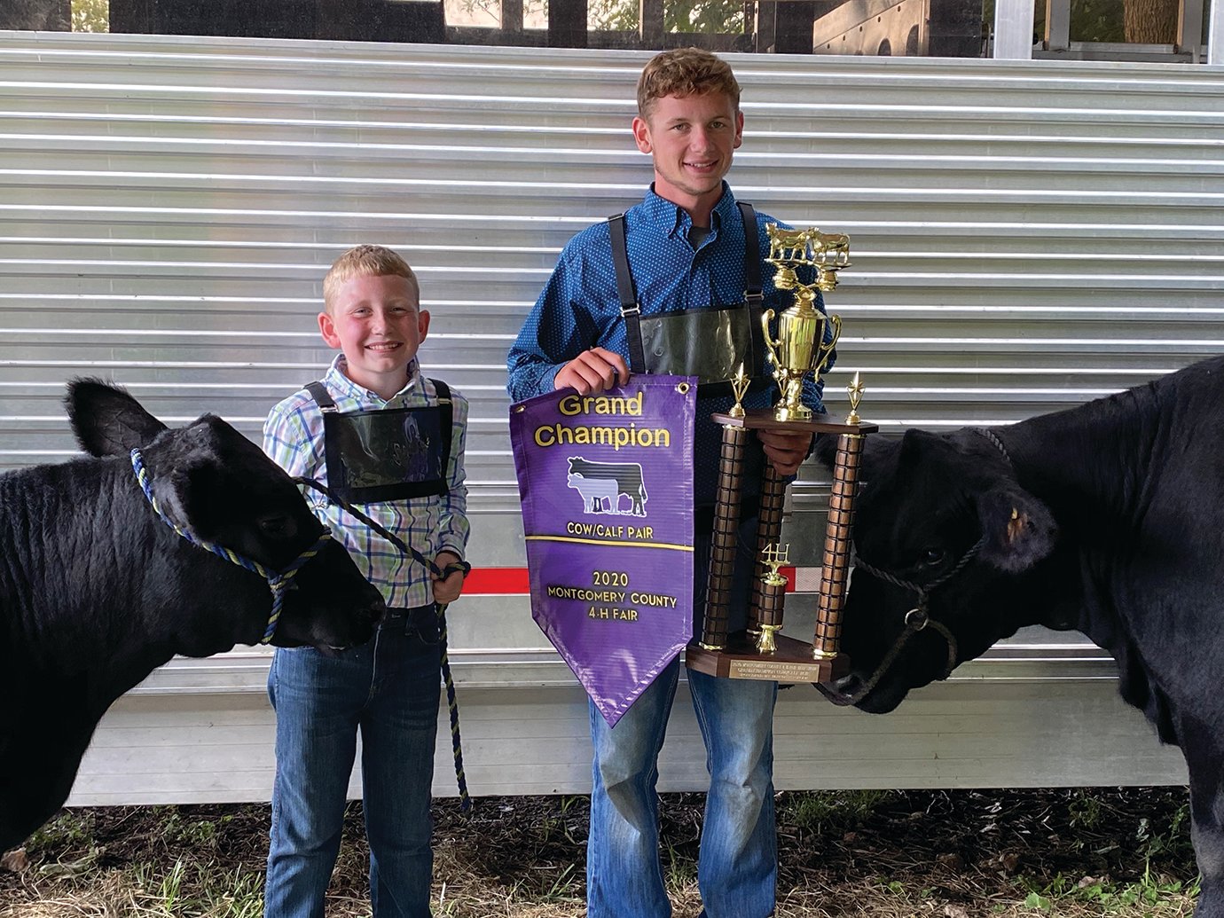 Kelby Coon and older brother Colby show off their prize mom and calf at the 2020 Montgomery County 4-H Fair.