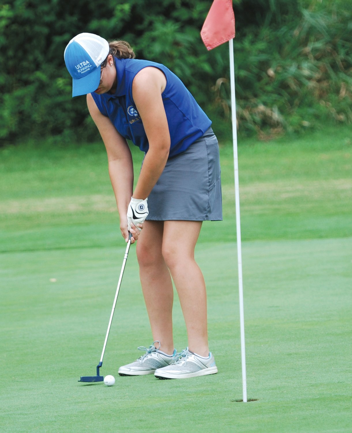 Crawfordsville's Gwyn Redding sinks a short putt for the Athenians on No. 15 on Thursday evening against University and Covington. Redding shot a 57.