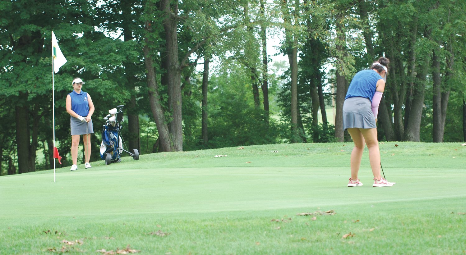 Crawfordsville's Bailey Mittal putts on the No. 17 green at Crawfordsville Municipal Golf Course on Thursday. The senior shot a 44.