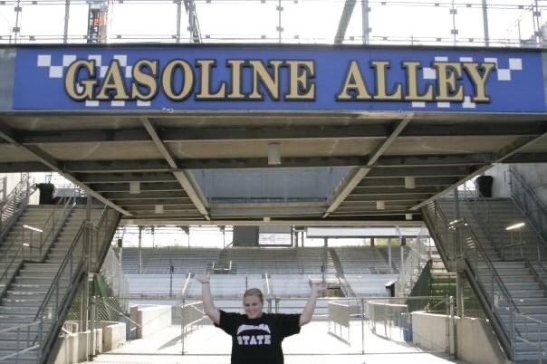Chelsea Ebaugh stands in Gasoline Alley at the Indianapolis Motor Speedway. Ebaugh, whose family has attended the Indianapolis 500 for years, will watch this year's race on television after the track was closed to fans.
