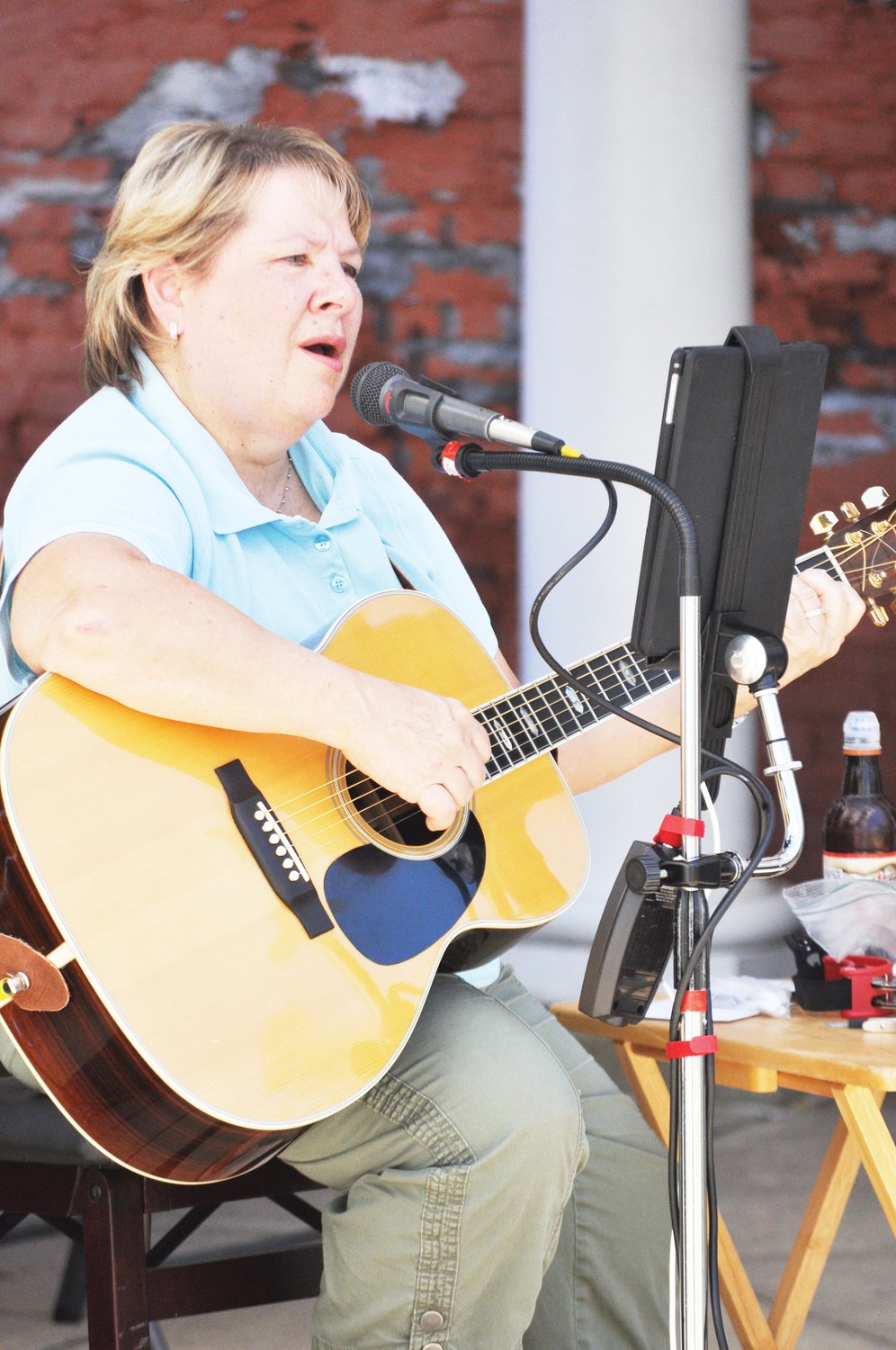 Folk artist Sharon McKnight performs during Crawfordsville Main Street's Lunch on the Plaza 2.0 at Marie Canine Plaza Friday.