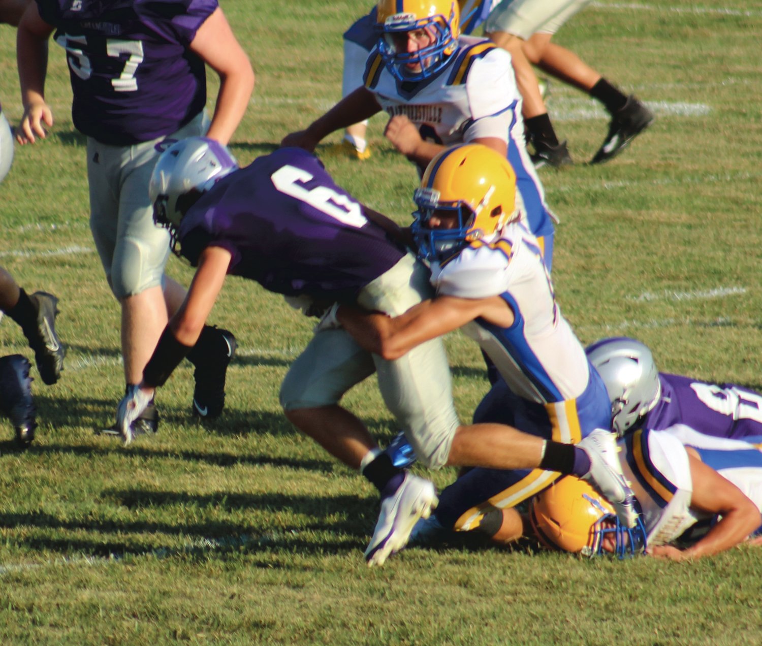 Crawfordsville's Ethan Powell tries to bring down Michael LeBlanc of Greencastle Friday night.