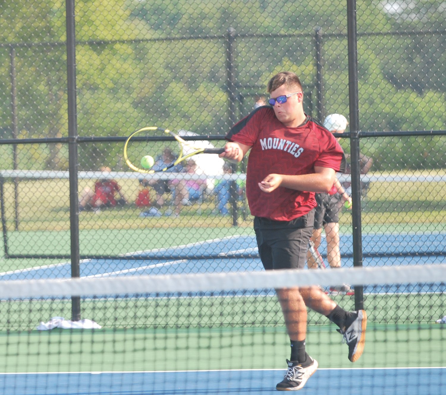 Southmont's Mason Hall returns a ball at No. 1 doubles against Fountain Central on Monday.