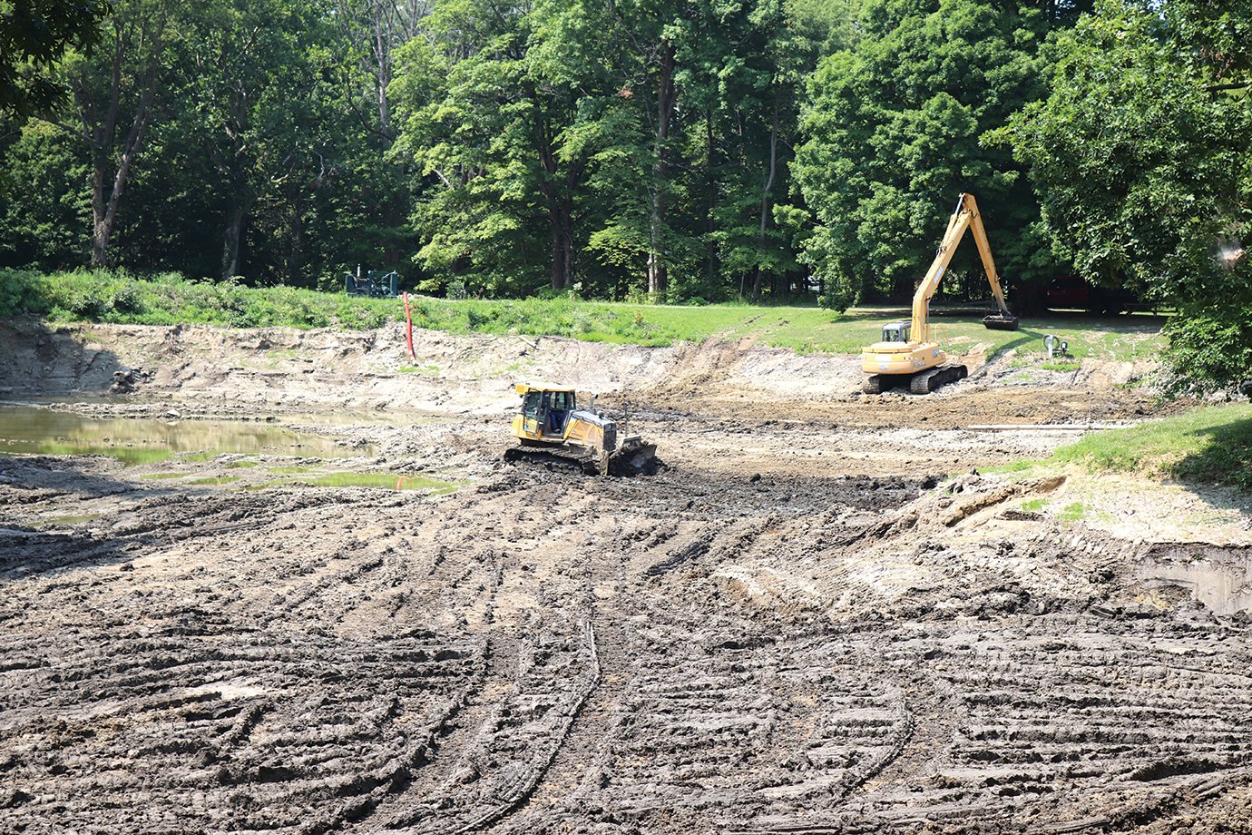 The Darlington Conservation Club pond, seen from a campsite on the property's east end, looks strange to those familiar with the property as crews work to improve the club premises.