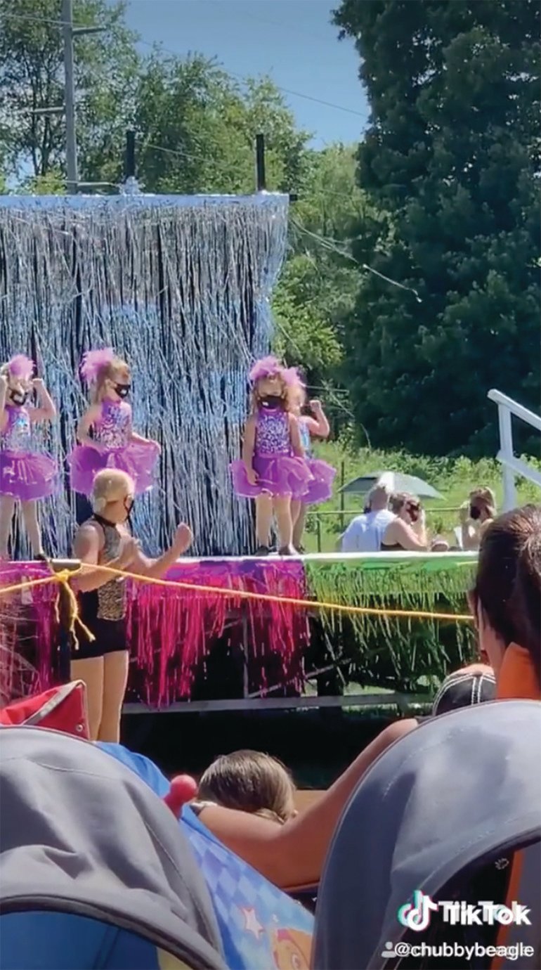 Charlie Cosby, right, stands completely still during a Dance By Deborah recital on Aug. 16 at Milligan Park. Her older sister, 12-year-old Gianna Cosby, is seen leading the recital while attempting to get her little sister involved.