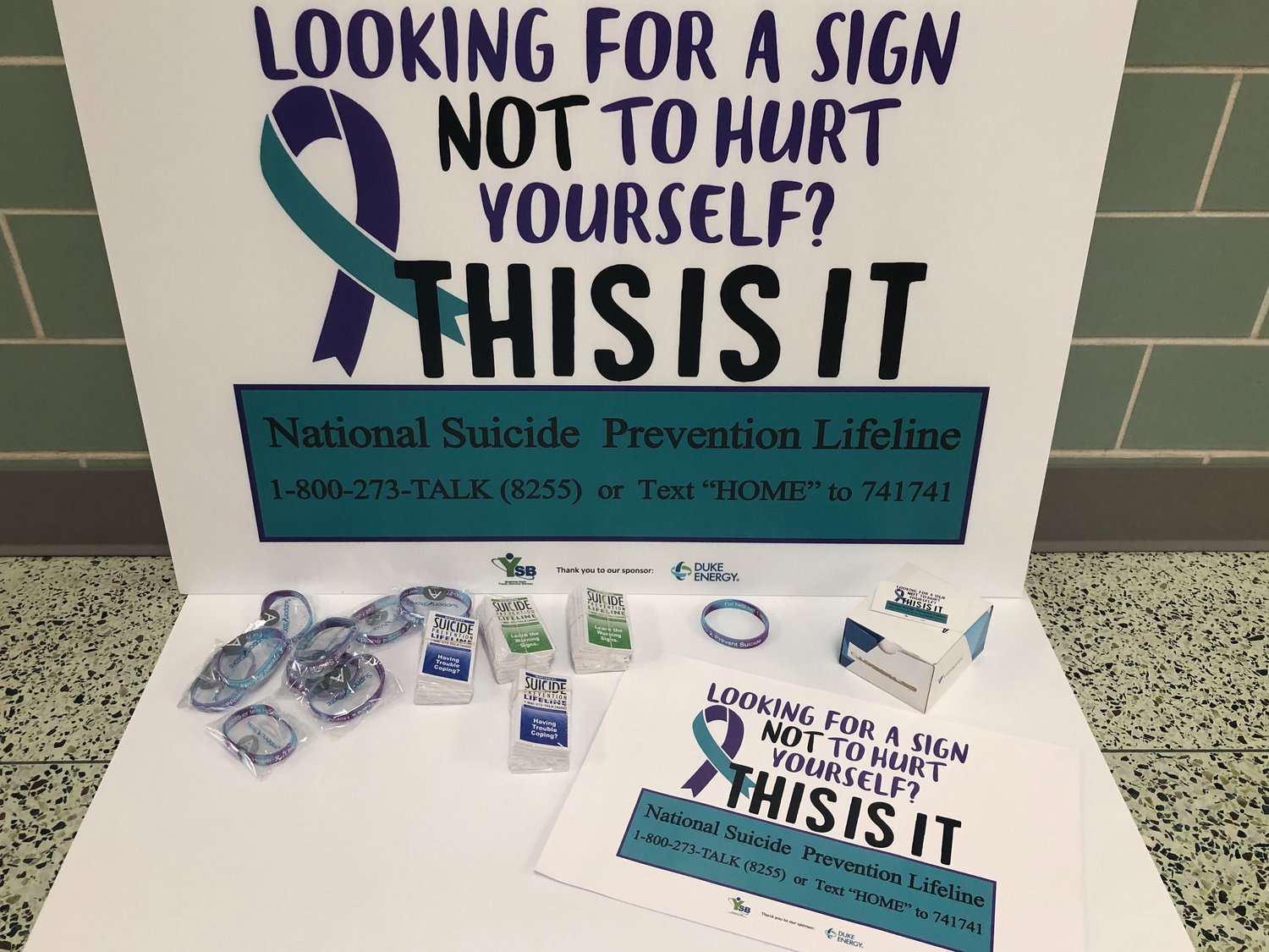 Montgomery County Youth Service Bureau's Suicide Prevention Awareness Month campaign includes yard signs, bracelets and wallet cards listing hotline numbers and warning signs.