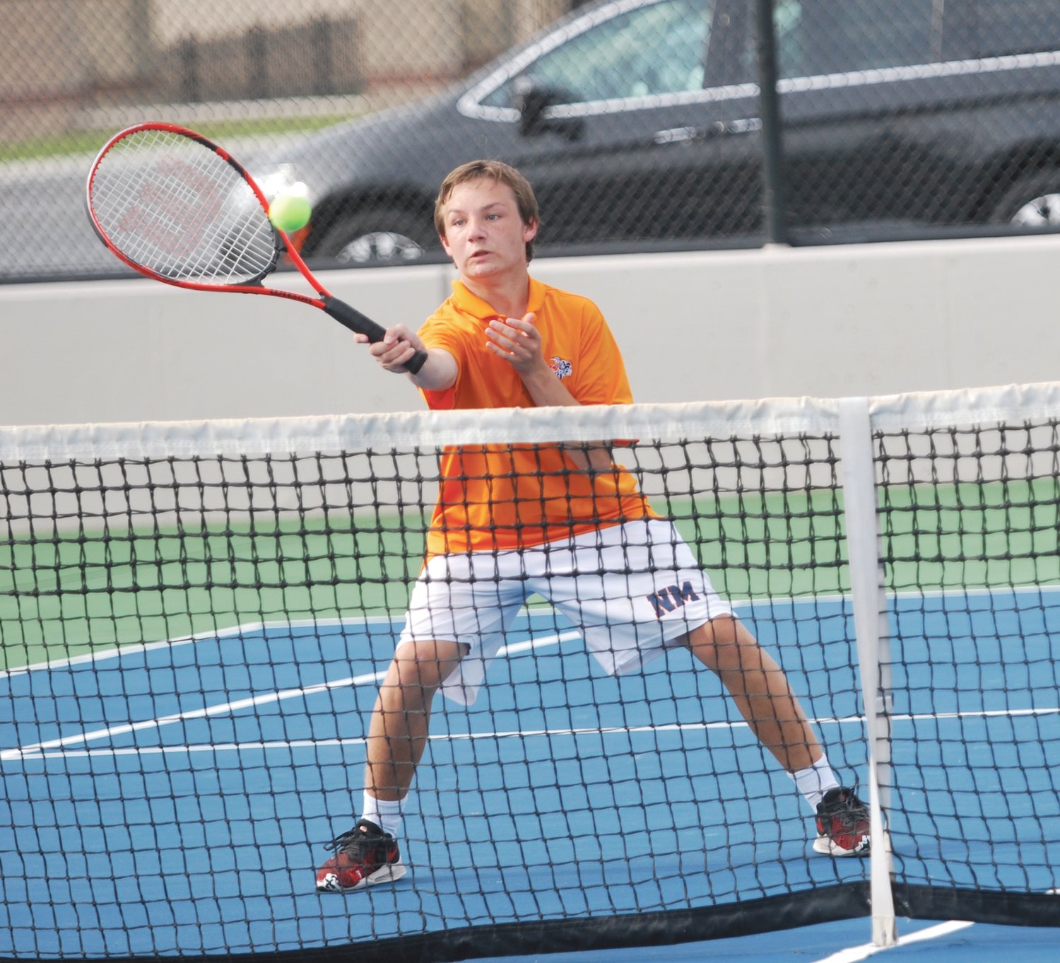 North Montgomery's Will McKinnis competes at No. 1 doubles for the Chargers on Monday against North Montgomery.