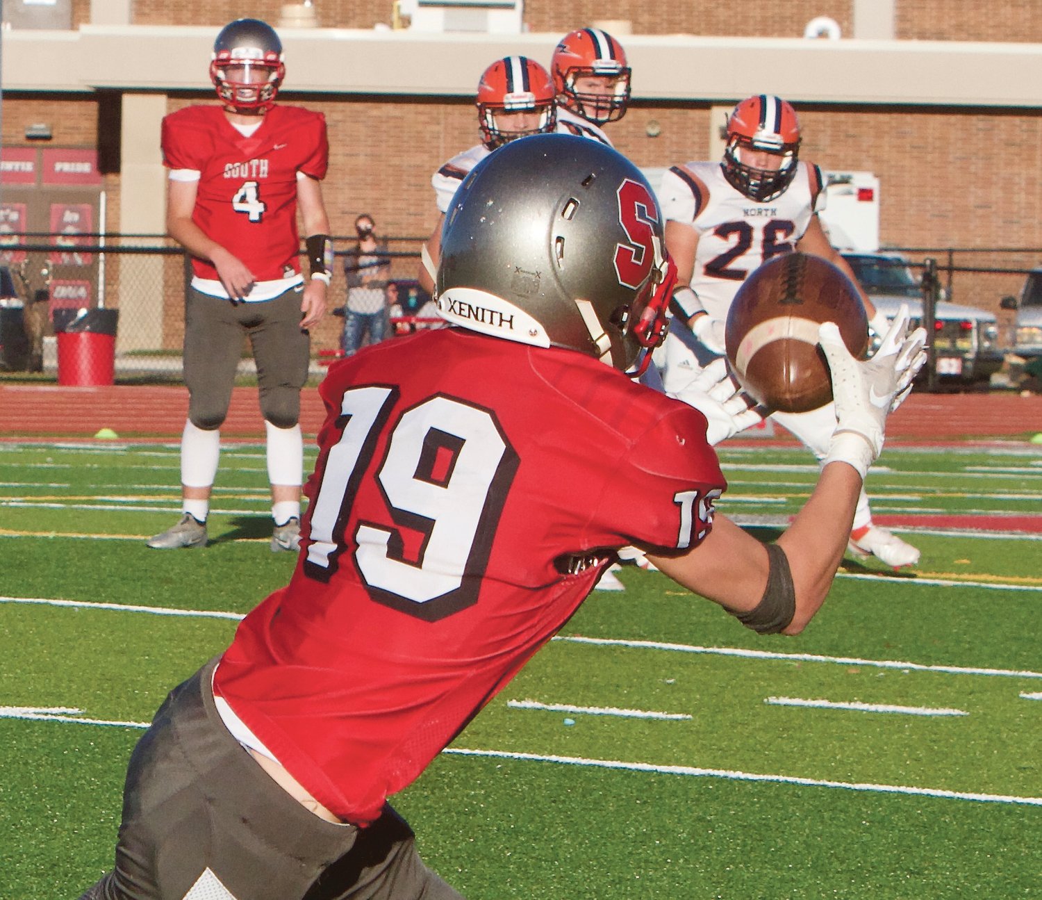 Southmont's Cale Hess snags a pass from Nick Scott in the Mounties' 28-6 loss to North Montgomery.