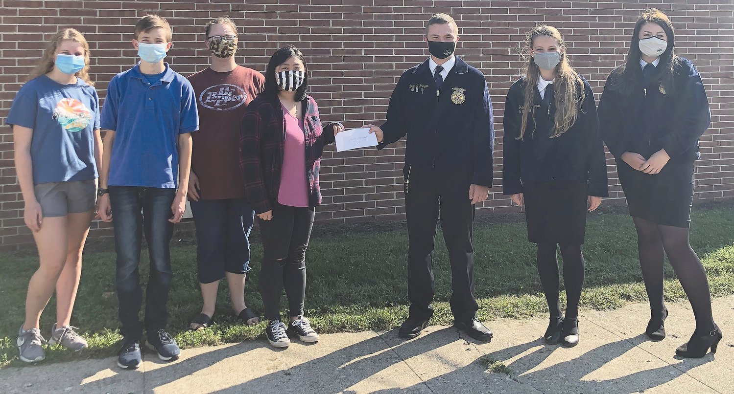 Pictured, from left, are Megan Scheidler, Caleb Chastain, Mary Browning and Sully Caldwell, all YAR members, FFA president Drew Runyan, FFA member Grace Runyan and FFA reporter Grace Shrader.