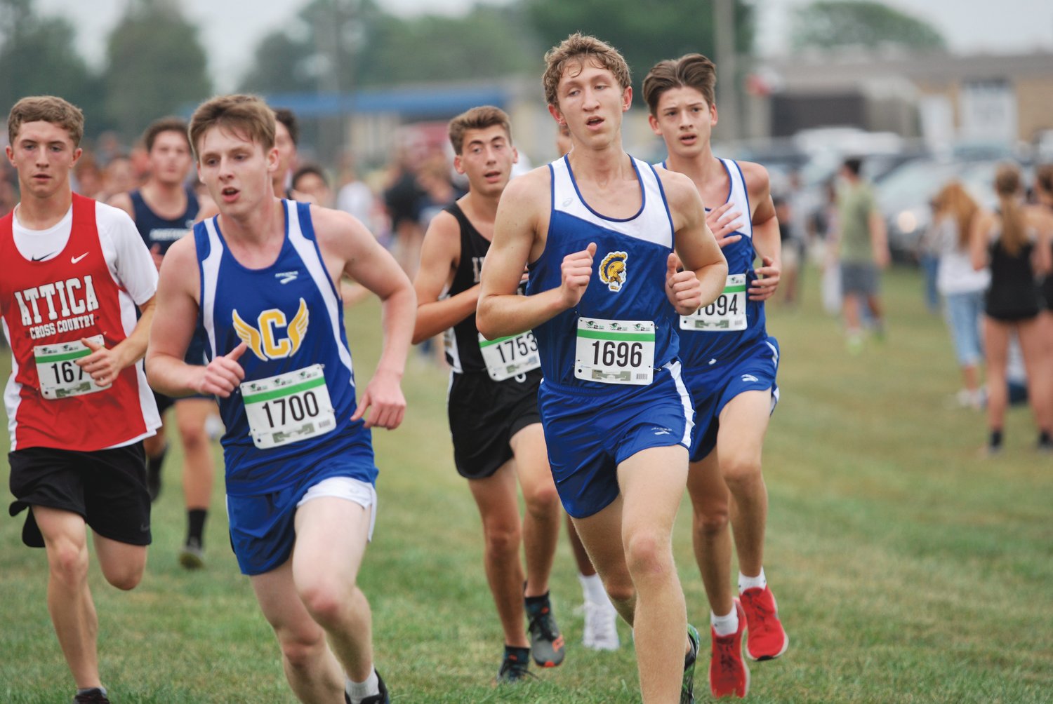 Crawfordsville's Nathaniel Million, Ian Hensley, and Roman Contreras pack run for the Athenians at the Charger Classic on Thursday.