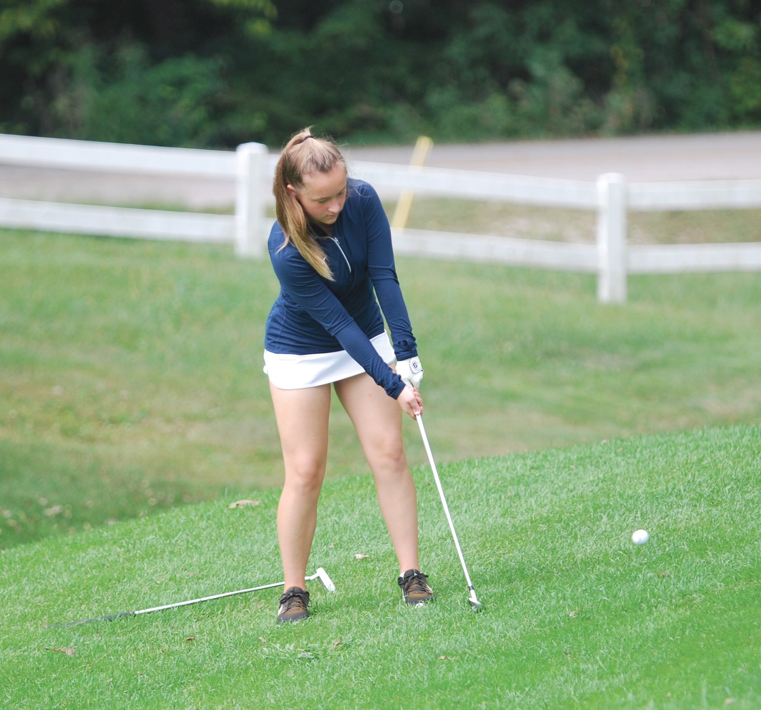 North Montgomery's Maggie Yeager chips toward the green on No. 18 the Crawfordsville Country Club on Saturday.