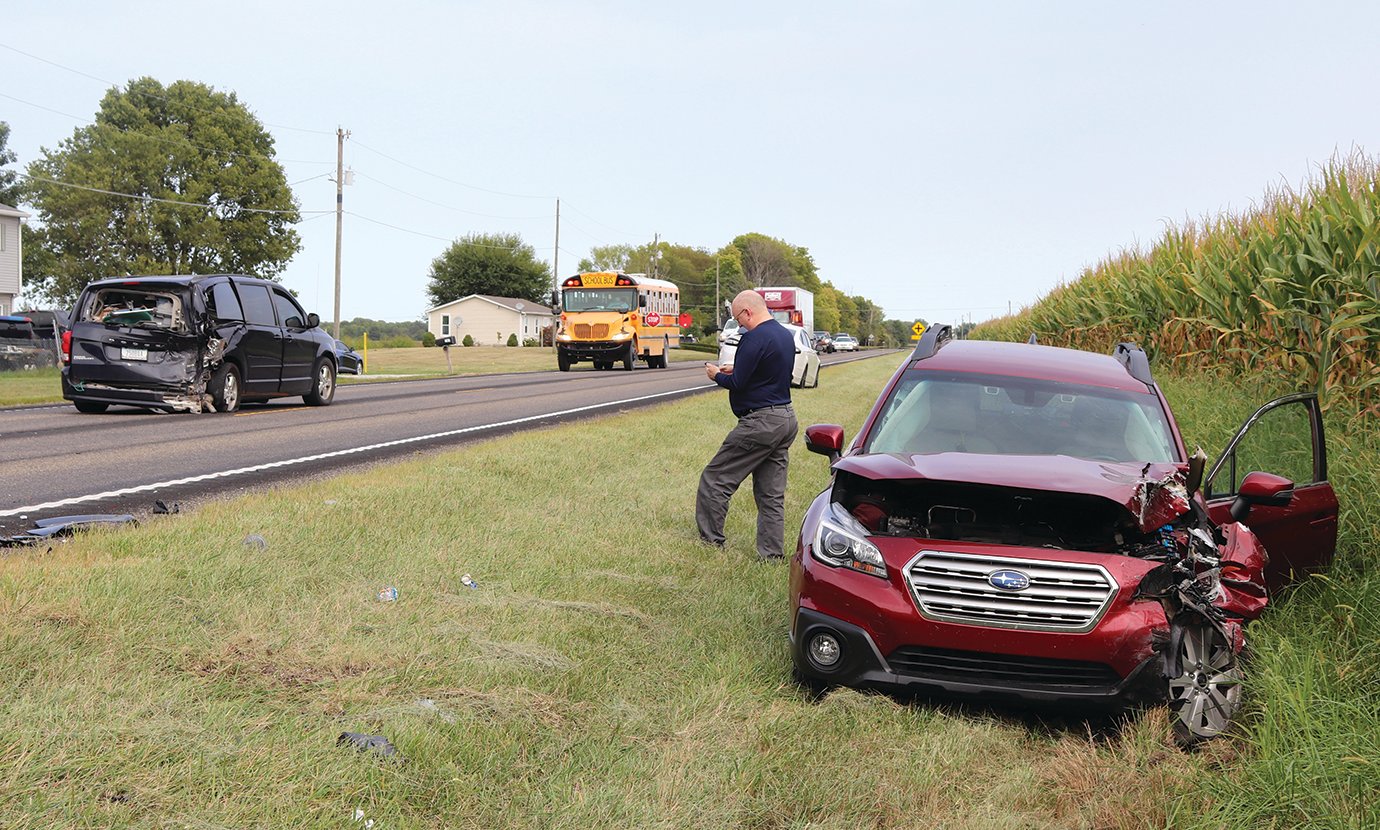 A collision between two vehicels at a rural bus stop Wednesday afternoon resulted in minor injuries for the drivers. A nearby school bus, stopped to drop off students, was not involved in the crash.