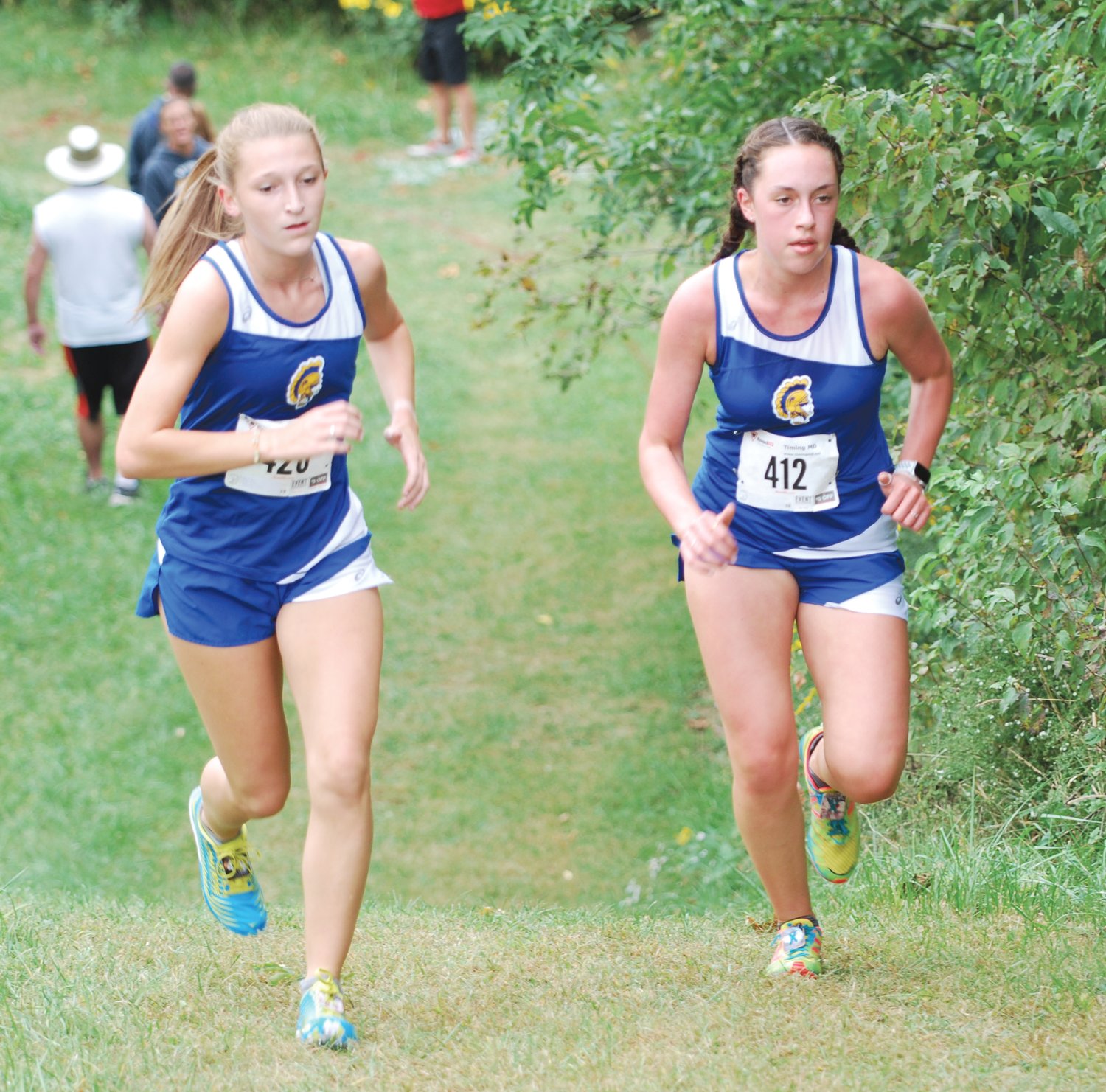 Crawfordsville's Elyse Widmer and Olivia Biddle battle the hill at Southmont during the Montgomery County meet on Thursday.