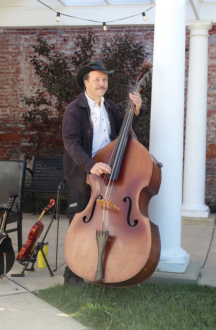 Dennis Beach of the Bal-Hinch Bunch switches to the standup bass for a few numbers Friday during Lunch on the Plaza.