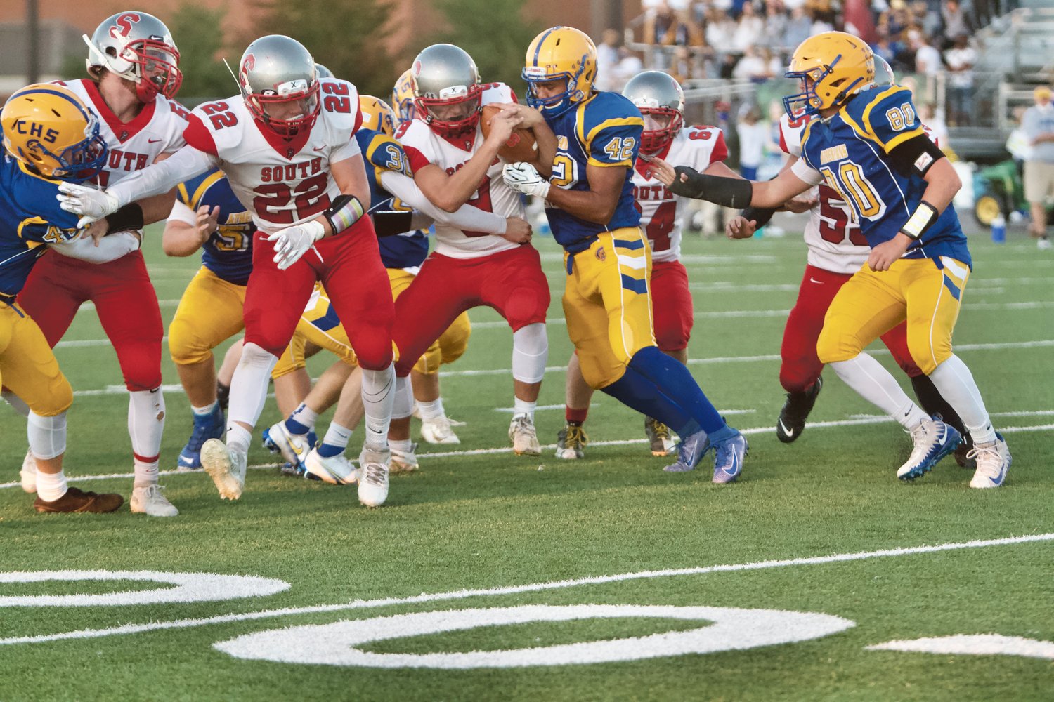 Crawfordsville defense tries to keep Isaiah McMasters from a first down.