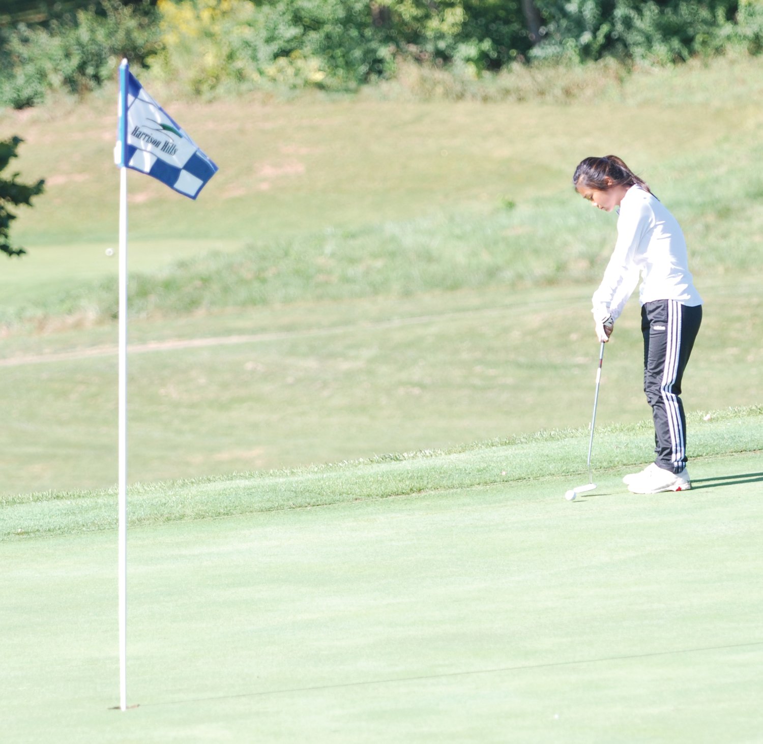 North Montgomery's Grace Littell putts on No. 9 at Harrison Hills on Saturday. Littell advanced to Saturday's IHSAA Regional after scoring a 104 at the sectional.